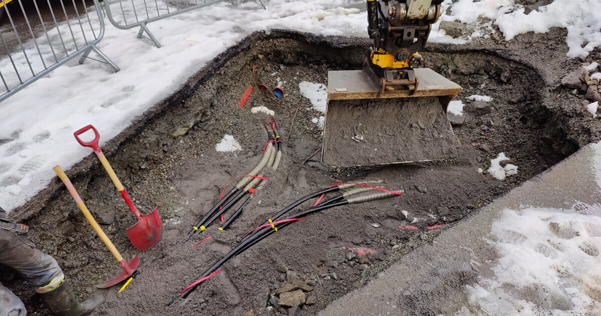 Excavated trench with electrical cables exposed